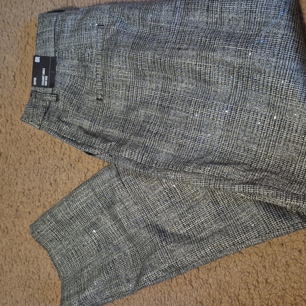 Black and gray with sparkle. Brand new with tags.